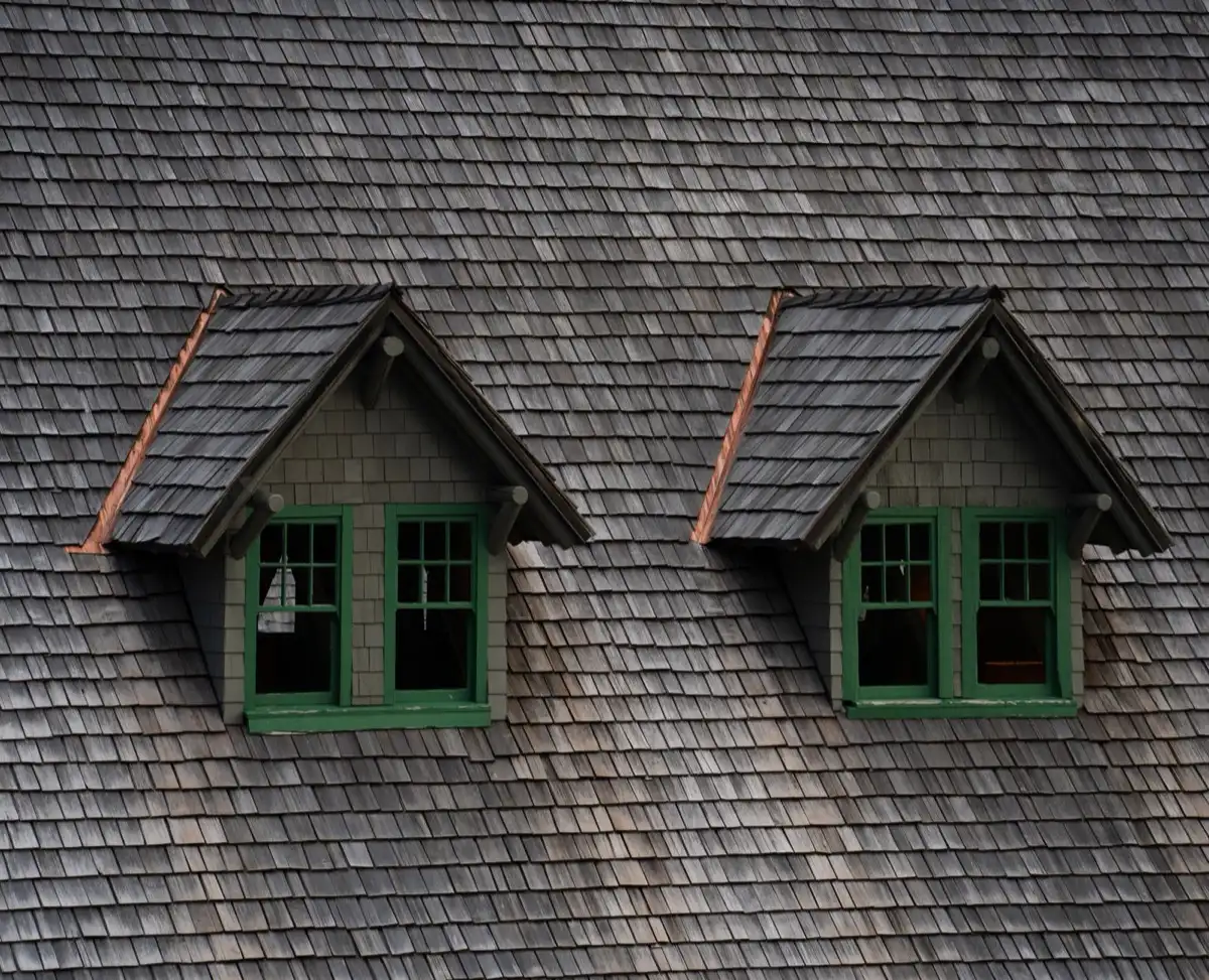 Dormers on a shingle roof in Naperville, IL, where step flashing and kickout flashing carry water past the walls
